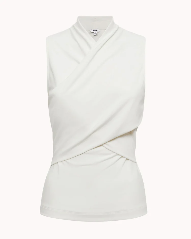 sleeveless+white+wrap+top+on+a+plain+beige+background. balletcore