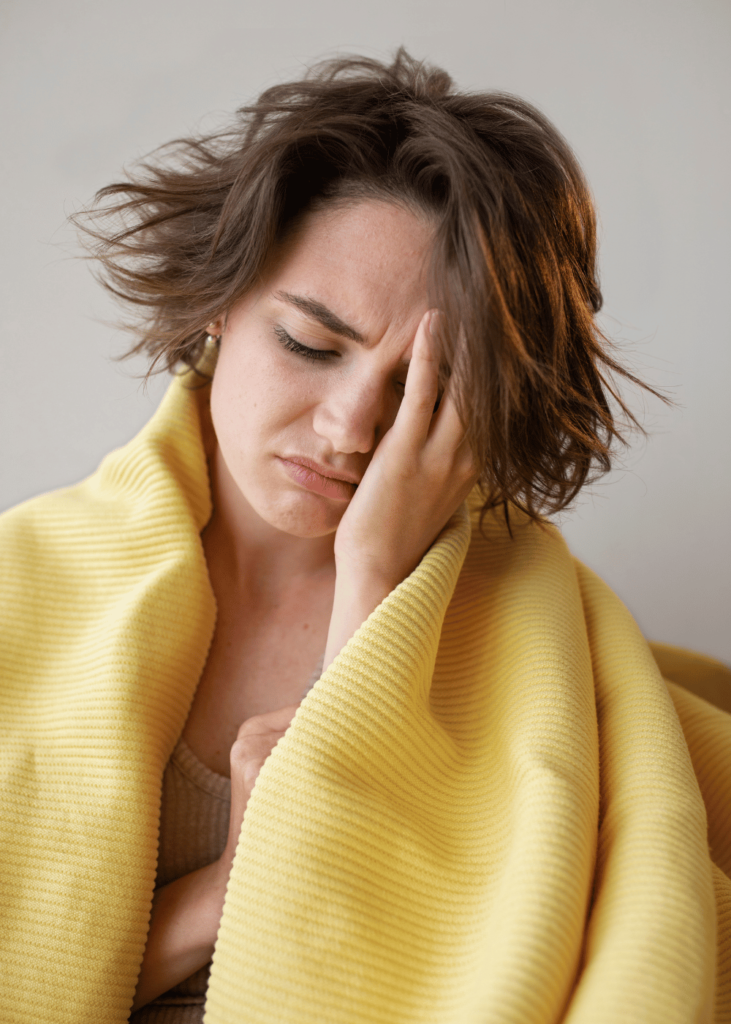 woman covering herself with a blanket. affirmations for anxiety