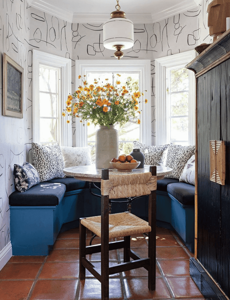 colourful breakfast nook in a bay window area