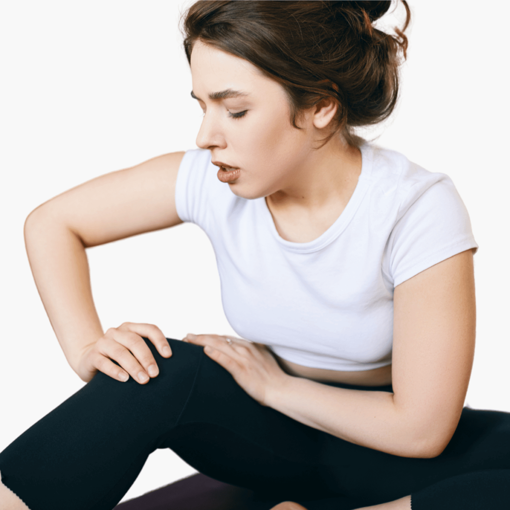 unhappy sporty girl grabbing knee, trying to massage aching area