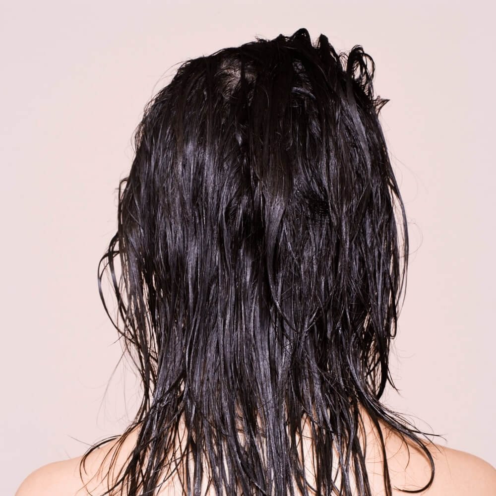 Back view of a woman with wet hair