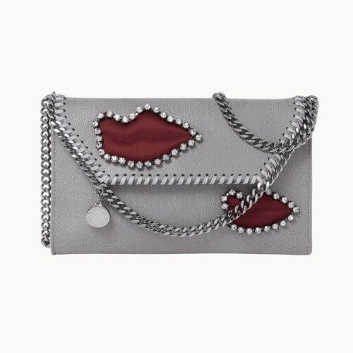 Grey shoulder with red lips decoration. Vegan Luxury Brands