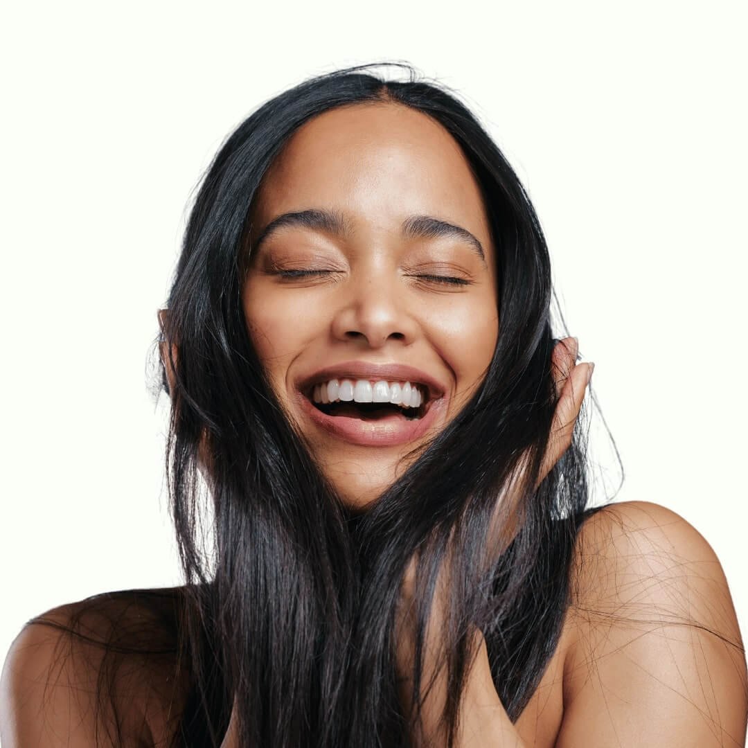 Woman smiling holding her hair. Best Deep Conditioners For High Porosity Hair