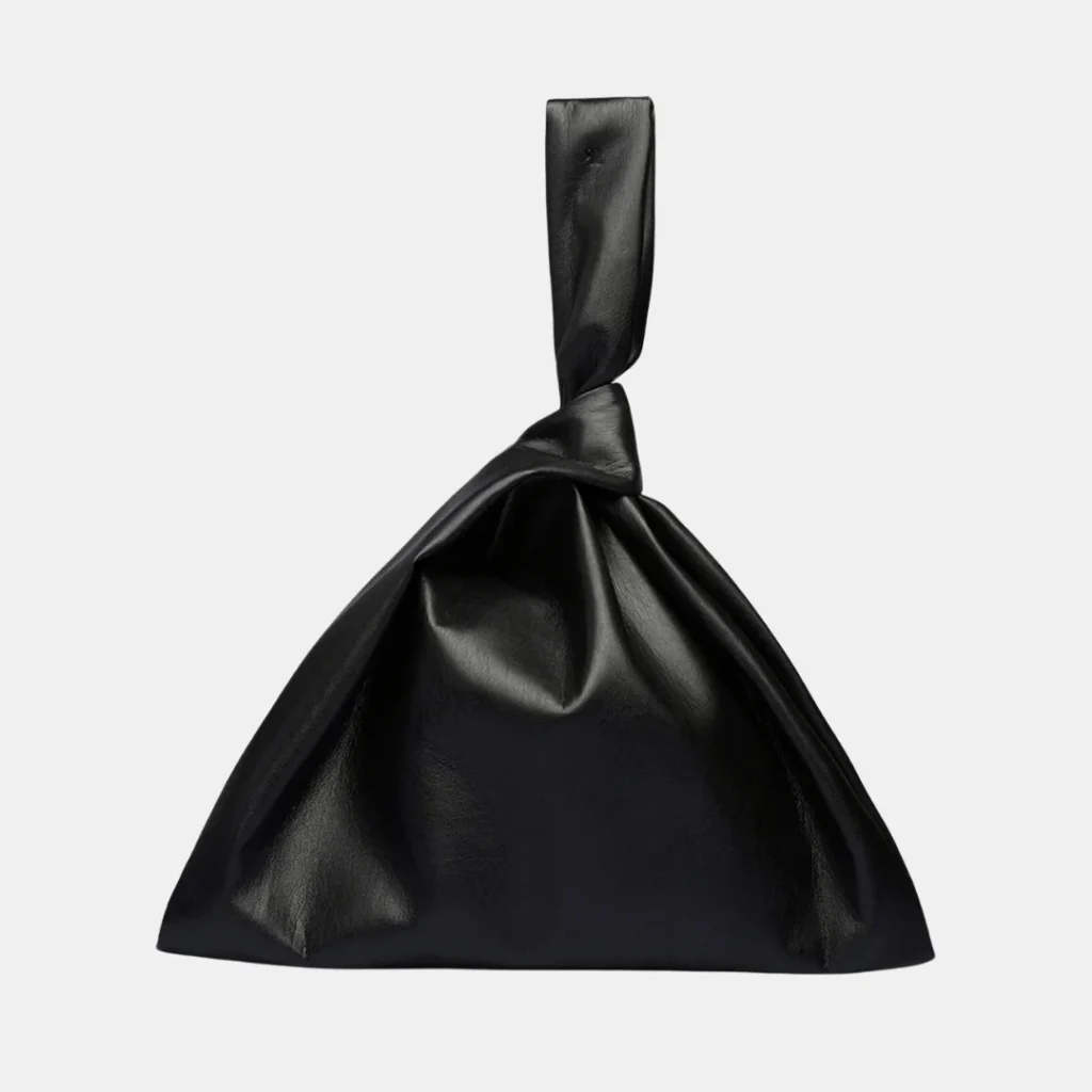 black vegan leather bag with a slouchy triangular shape