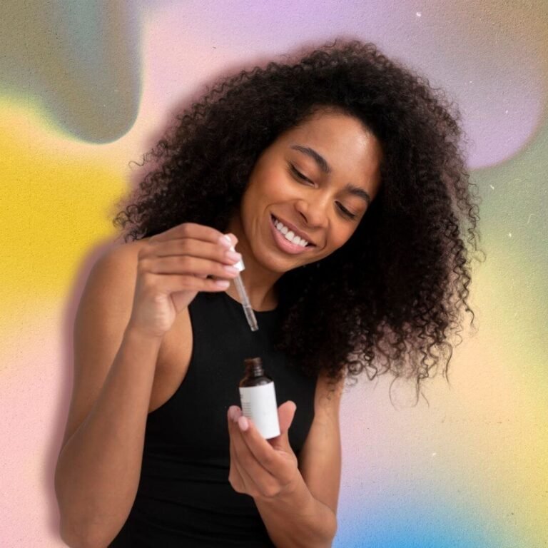 Smiling woman using a pipette. Hair oil concept. High porosity hair