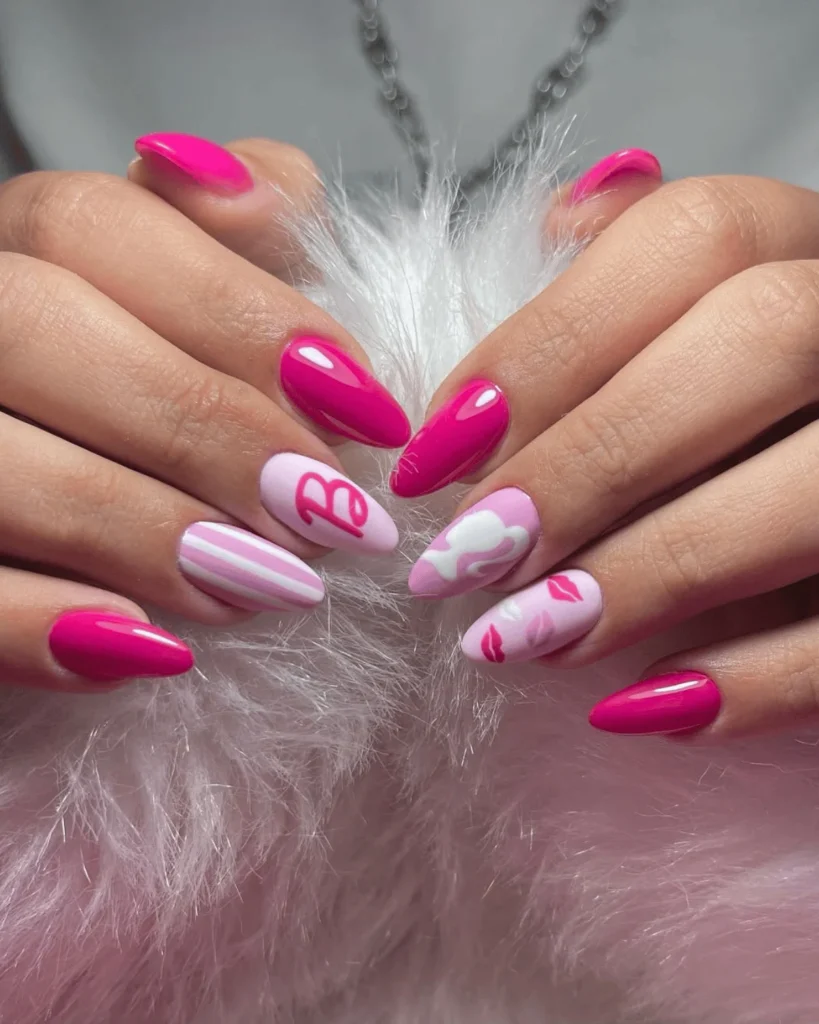 Baby pink and hot pink nails with the barbie logo