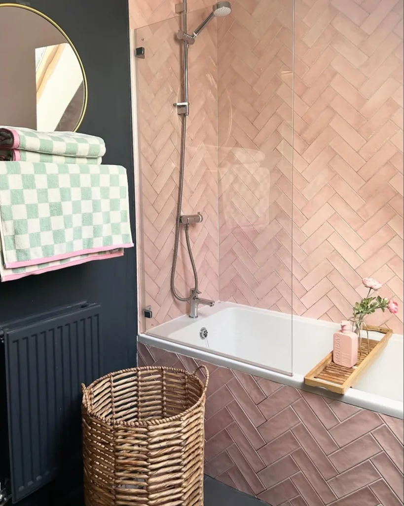 Pink and bath bathroom with customer pink tiled bath panel. 