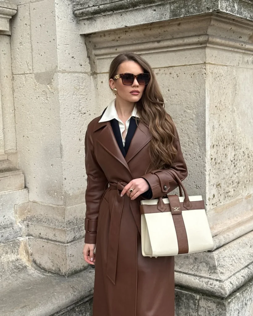 Women wearing a brown leather parka coat with sunglasses